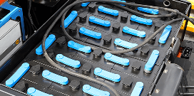 An electric battery is shown with wires connected to it