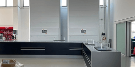 A Modula SLIM system in large room with various other equipment in a warehouse facility