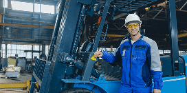 Workers operating forklifts outside while other workers walk around them